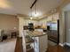 The kitchen has stainless appliances, granite countertops, and a breakfast bar with seating for two at 20971 Shoreline Ct # 214, Noblesville, IN 46062