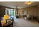 Bright living room features a ceiling fan and a sliding glass door to the outside at 20971 Shoreline Ct # 214, Noblesville, IN 46062