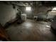 Unfinished basement space with concrete floor, laundry hookups, and a small window at 2124 W 64Th St, Indianapolis, IN 46260