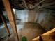 Unfinished basement space with exposed ceiling and foundational walls at 2124 W 64Th St, Indianapolis, IN 46260