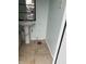 A close-up shot of a small bathroom with tile flooring and a pedestal sink at 2124 W 64Th St, Indianapolis, IN 46260