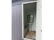Exterior shot of a small bathroom featuring tile flooring and a pedestal sink at 2124 W 64Th St, Indianapolis, IN 46260