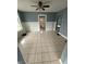 Open dining area with neutral tones, tiled floor, and arched doorway at 2124 W 64Th St, Indianapolis, IN 46260
