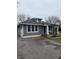 Charming single-story home with a covered porch and tidy landscaping at 2124 W 64Th St, Indianapolis, IN 46260
