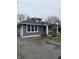 Charming single-story home featuring a covered porch and driveway at 2124 W 64Th St, Indianapolis, IN 46260