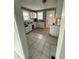 Kitchen with tile flooring and ample counter space, awaiting a modern update at 2124 W 64Th St, Indianapolis, IN 46260