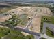 Aerial view of new construction with ponds throughout the community at 2199 Warbler St, Danville, IN 46122