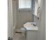 Bathroom features white fixtures, including a sink and toilet, with a shower and vanity cabinet at 2260 N Graham Ave, Indianapolis, IN 46218