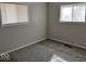 Cozy bedroom with neutral walls, soft carpet, and natural light streaming through the dual windows at 2260 N Graham Ave, Indianapolis, IN 46218