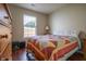 Cozy bedroom with a bright, colorful quilt and light wood dresser at 2390 Lakecrest Dr, Columbus, IN 47201