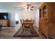 Dining room featuring wood-look vinyl flooring, a ceiling fan, and a wooden china cabinet at 2390 Lakecrest Dr, Columbus, IN 47201
