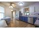 Spacious kitchen featuring stainless steel appliances, two-tone cabinets, and wood-look vinyl flooring at 2390 Lakecrest Dr, Columbus, IN 47201