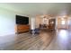 Spacious living room showcasing wood-look vinyl flooring, natural light, and an open floor plan at 2390 Lakecrest Dr, Columbus, IN 47201
