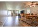 Open-concept living room and dining area featuring wood-look vinyl flooring and ample natural light at 2390 Lakecrest Dr, Columbus, IN 47201