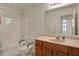 Bright bathroom featuring a shower and tub combination, and safety bars for accessibility at 2755 Rylee Ct, Greenwood, IN 46143