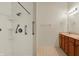This bright bathroom has a walk-in shower with grab bars and double sinks at 2755 Rylee Ct, Greenwood, IN 46143