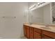 A bathroom features double sinks with wood cabinets and a large mirror at 2755 Rylee Ct, Greenwood, IN 46143