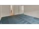 A neutral bedroom has clean, painted walls and blue, patterned carpeting at 2755 Rylee Ct, Greenwood, IN 46143