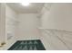 A walk-in closet has white walls, wire shelving, and patterned carpet at 2755 Rylee Ct, Greenwood, IN 46143