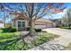 Charming home with attached garage, manicured landscaping, and mature tree at 2755 Rylee Ct, Greenwood, IN 46143
