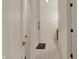 A hallway has a decorative tile floor and a door to a bathroom at 2755 Rylee Ct, Greenwood, IN 46143