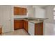 This kitchen features wood cabinets, a stainless steel sink, and a convenient dishwasher at 2755 Rylee Ct, Greenwood, IN 46143