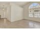 Bright living room featuring tile floors, large windows, and a chandelier at 2755 Rylee Ct, Greenwood, IN 46143