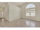 Bright living room featuring tile floors, large windows, and a chandelier at 2755 Rylee Ct, Greenwood, IN 46143
