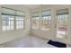 Bright sunroom featuring three large windows and a glass door to the outdoor space at 2755 Rylee Ct, Greenwood, IN 46143