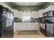Functional kitchen featuring white cabinets and modern appliances at 282 N Vine St, Plainfield, IN 46168