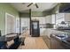 Bright kitchen with ample counter space, black appliances, and eat in dining area at 282 N Vine St, Plainfield, IN 46168