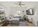 Bright living room with hardwood floors, a ceiling fan, and a comfortable sectional sofa at 282 N Vine St, Plainfield, IN 46168