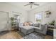 Inviting living room featuring a large sectional sofa, plants, and natural light at 282 N Vine St, Plainfield, IN 46168