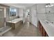 Elegant bathroom with a glass-enclosed shower, soaking tub, and stylish vanity at 2859 Dursillas Dr, Plainfield, IN 46168