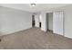 Bedroom featuring neutral carpet, multiple closets, and two entry ways at 2859 Dursillas Dr, Plainfield, IN 46168