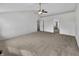 Spacious carpeted bedroom with vaulted ceiling, ceiling fan, and multiple doors at 2859 Dursillas Dr, Plainfield, IN 46168