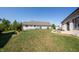 Spacious backyard featuring lush green grass, and a patio set for outdoor enjoyment at 2932 Camden Ct, Greenwood, IN 46143