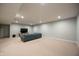 Spacious finished basement with carpet, recessed lighting, and a comfortable sectional sofa at 2932 Camden Ct, Greenwood, IN 46143