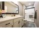 Bathroom featuring a black framed mirror, white cabinetry, black hardware and a shower with black trim at 2932 Camden Ct, Greenwood, IN 46143