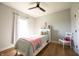 Cozy bedroom with a single bed, hardwood floors, and natural light at 2932 Camden Ct, Greenwood, IN 46143