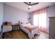 Bright bedroom with a desk, chair, and natural light at 2932 Camden Ct, Greenwood, IN 46143