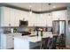 Stylish kitchen featuring white cabinets, stainless appliances, and a center island with seating at 2932 Camden Ct, Greenwood, IN 46143