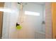 Modern tiled shower with a window and a built-in seat at 2932 Camden Ct, Greenwood, IN 46143