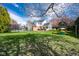 Expansive backyard with lush lawn, a play set, and well-maintained landscaping, great for Gathering fun at 3165 Hazel Foster W Ct, Carmel, IN 46033