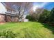 Spacious backyard with a lush lawn and established trees, providing privacy and ample outdoor space at 3165 Hazel Foster W Ct, Carmel, IN 46033