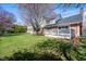 Green backyard showing a deck and house exterior, offering a large outdoor area for recreation and relaxation at 3165 Hazel Foster W Ct, Carmel, IN 46033