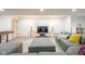 Finished basement with shuffleboard, media center, and comfortable seating for entertaining guests at 3165 Hazel Foster W Ct, Carmel, IN 46033