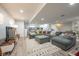 Spacious finished basement with stylish gray sectional sofa and ample living space at 3165 Hazel Foster W Ct, Carmel, IN 46033