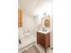 Updated bathroom with modern vanity, stylish mirror, and decorative wallpaper for a fresh, contemporary look at 3165 Hazel Foster W Ct, Carmel, IN 46033