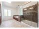 Large bathroom featuring soaking tub, separate tiled shower, and skylight at 3165 Hazel Foster W Ct, Carmel, IN 46033